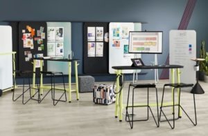 two standing desks each with two chairs
