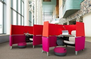 colorful modern office cubicles with chair, desk, and footrest