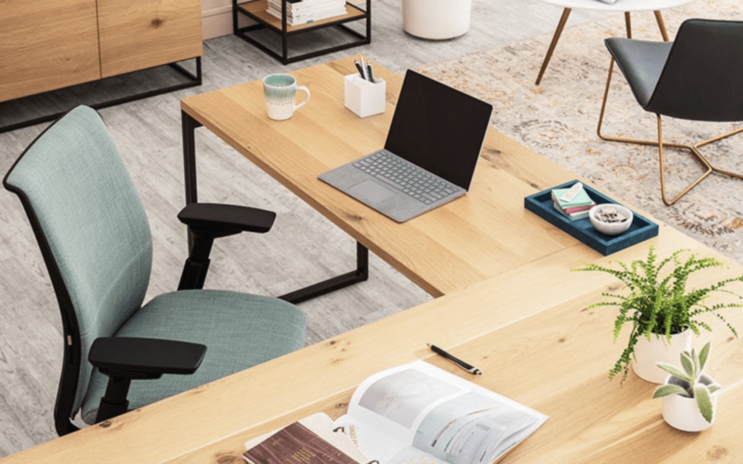 L-shaped desk with ergonomic chair to show how office furniture affects productivity