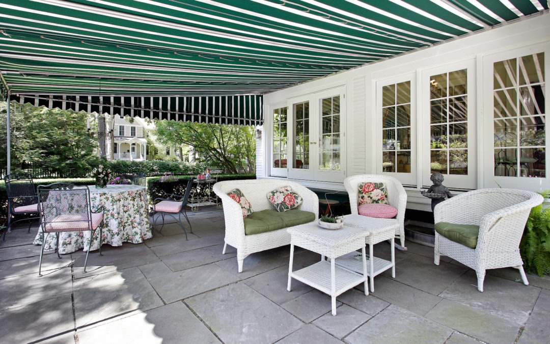 Patio in luxury home with green residential awning