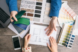 communication between commercial interior designer and customer. choice of colors and materials. selection of design elements for new interior repair. Work of designer and client. Working space top view