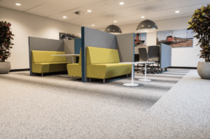 modern office with green chairs and newly installed commercial carpet