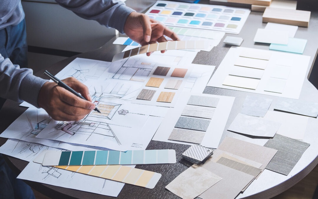 Architect designer Interior creative working hand drawing sketch plan blue print selection material color samples art tools to help find the perfect office color schemes