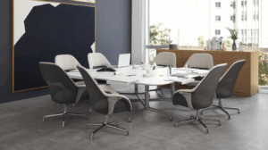 modern conference room with square desk, white and gray chairs, black and white art on the wall, large window and natural light. modern conference room design ideas