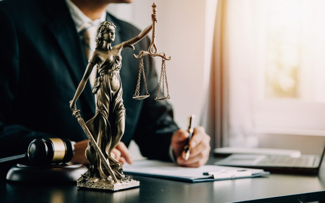 law office interior design desk with gavel and statue on