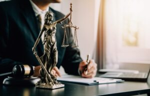 law office interior design desk with gavel and statue on