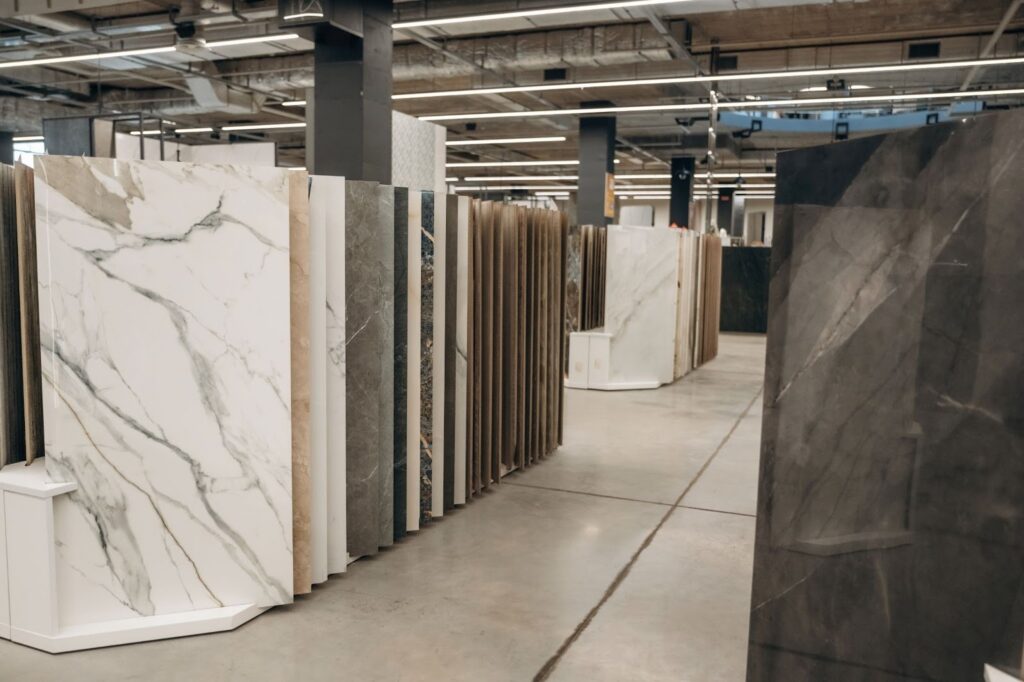 inside of a commercial flooring retail space showing large slabs of ceramic tile and flooring trends