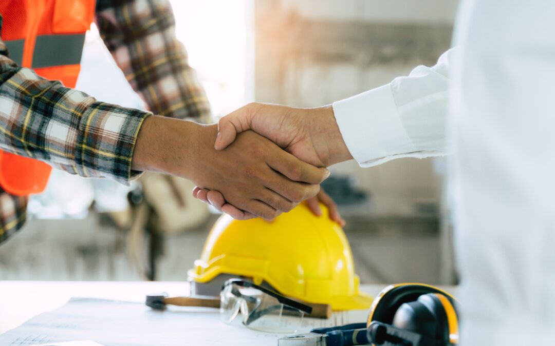 commercial flooring contractor shaking hands with business owner