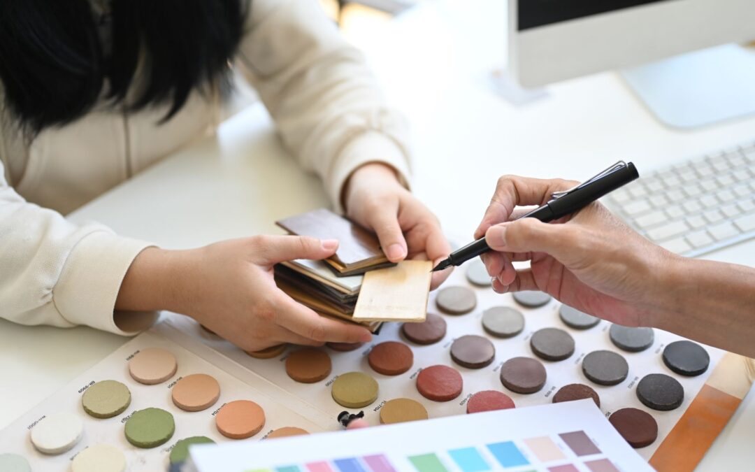 View of someone picking out colors and materials for a interior design project.
