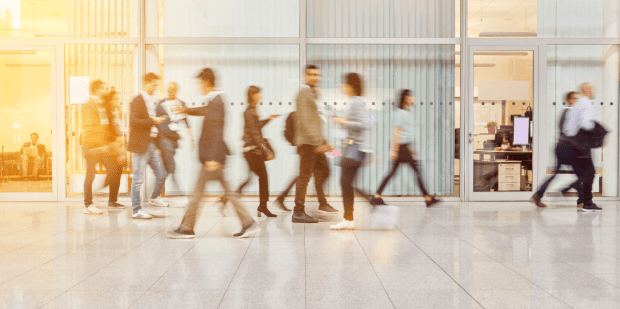 people walking through workplace